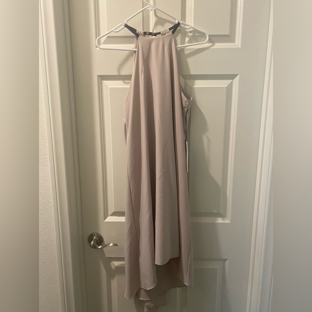 Champagne colored evening sleeveless dress.